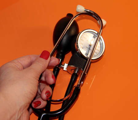 Tonometer in a woman's hand with a manicure. A device for measuring pressure.の写真素材