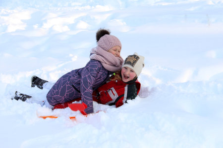 Girls on a winter background. Happy children in winter. Winter joy. 26.12.2020 Donetskのeditorial素材