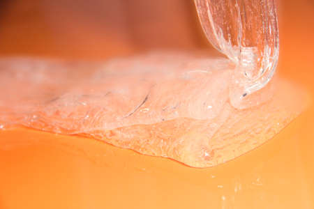 Slime on an orange backgroundの写真素材