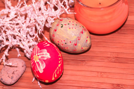 Easter eggs on a wooden background. A pink, colored egg.