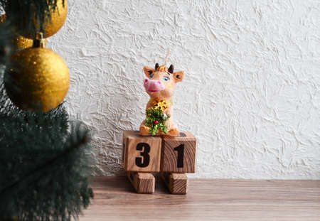 Cow on a sled with the number 31. Christmas background.の写真素材