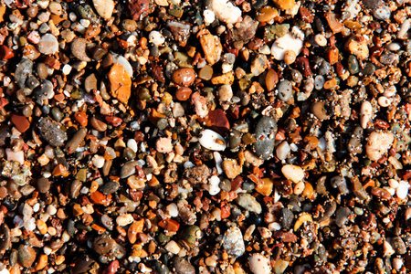 Background from multi-colored stones. Texture of sea stones. Red and blue pebbles. Stone beach. Minerals. Colorful stone. Semiprecious stones. Stereoscopic Cobblestone.の写真素材
