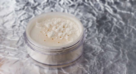 White loose powder on a light background.の写真素材