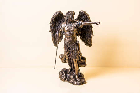 Statuette of Archangel Michael with wings and sword.の写真素材