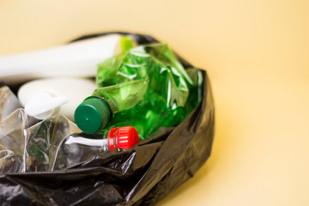 Plastic waste in a black trash bag. Recycling of plastics.の写真素材