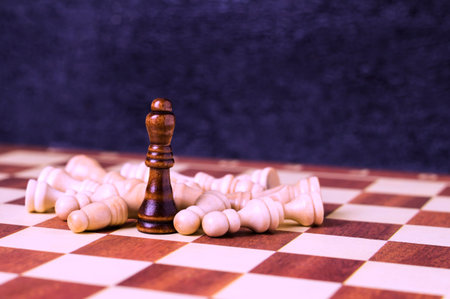 Game of chess. Queen on a chessboard with defeated pawns.