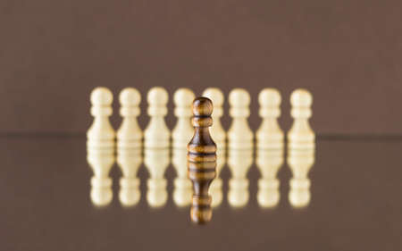 Wooden pawns on a dark background. Chess.の写真素材