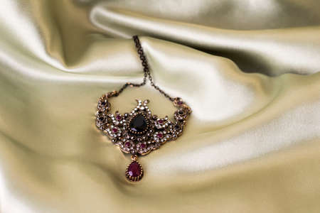 Necklace on light satin. Ancient decoration of the Ottoman Empire.の写真素材