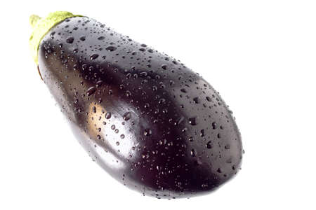 Eggplant in drops of water on a white background.の写真素材