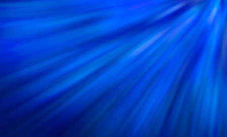 Blue background with rays. The abstraction is bright.の写真素材