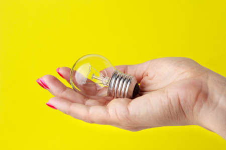 Light bulb in a woman's hand.の写真素材
