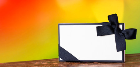 Gift box on a wooden table and bright background.の写真素材