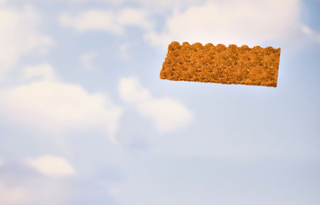 Rye crispbread on a background of the sky. Diet breakfast.