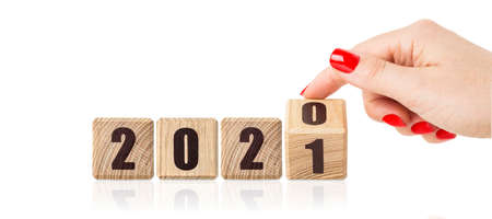 Wooden cubes with the inscription 2021, 2020. Christmas background.の写真素材