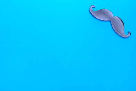 Iron mustache on a blue background. Male background.の写真素材