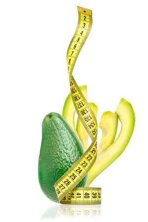 Avocado with meter isolated on white background. The concept of proper nutrition.の写真素材