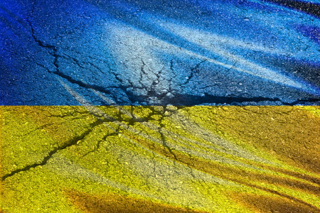 Flag of Ukraine with shelling texture on a concrete wall.の写真素材