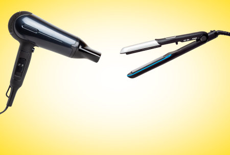 Hairdryer and hair straightener. Hairdresser's electrical appliances.の写真素材