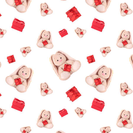 Seamless pattern with a rabbit and a red gift.の写真素材