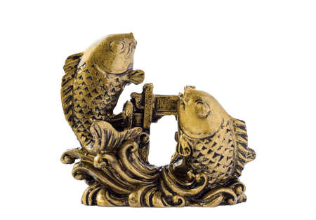 Bronze fish figurine isolated on a white background.の写真素材