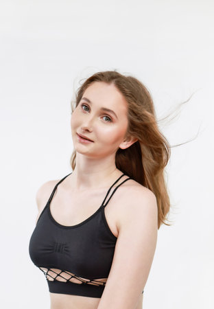 A woman in a black top on a white background.の写真素材