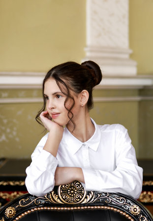 Portrait of a brunette in a white shirt.の写真素材