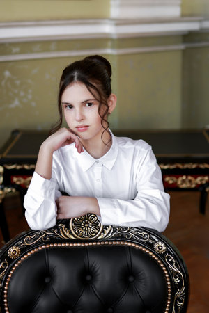 Portrait of a brunette in a white shirt.の写真素材