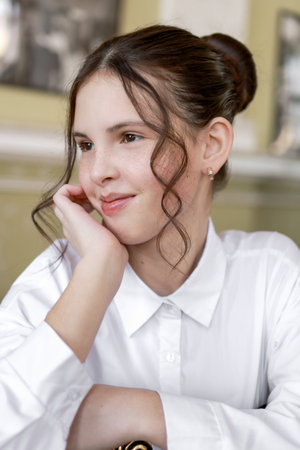 Portrait of a brunette in a white shirt.の写真素材