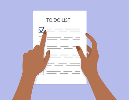 Womans hands holding a to-do list. Task completed.のイラスト素材