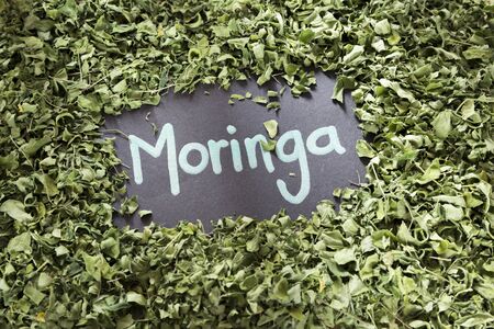 The word moringa on a background of leaves - Moringa oleiferaの写真素材