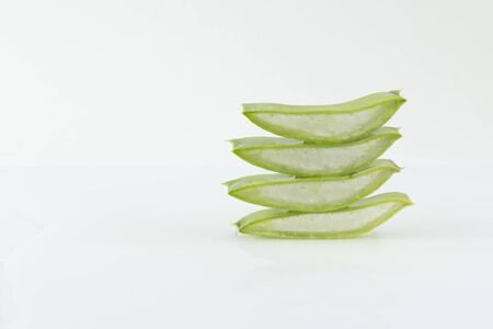 sliced aloe vera leaves on white backgroundの写真素材