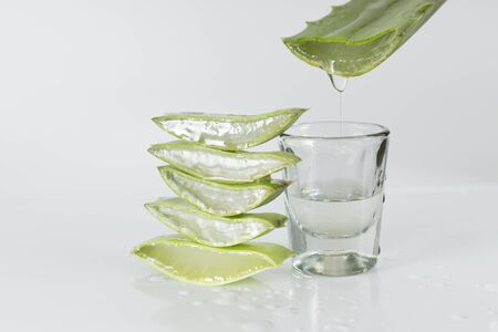 sliced aloe vera leaves on white backgroundの写真素材