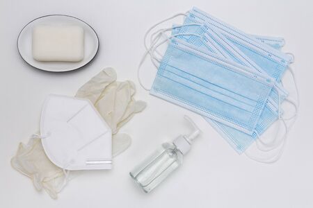 Surgical masks, disinfectant gel, gloves and soap to prevent coronavirus. All on white backgroundの写真素材