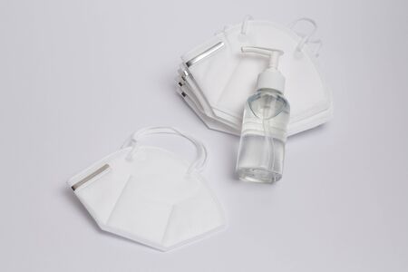 Surgical mask and antibacterial gel to prevent coronavirus. All on white background.の写真素材