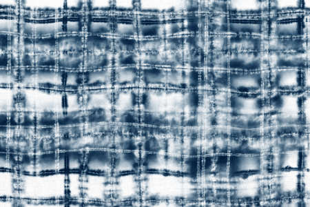 Indigo Blue Shibori Tie dye fabric texture pattern. White and Blue colors.の写真素材