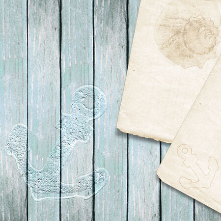 Nautical background with note  Wooden cover with an anchor print  Marine theme  の写真素材