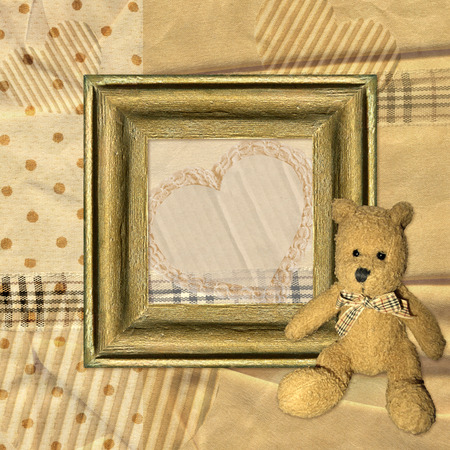 Vintage background with frame and Teddy bearの写真素材