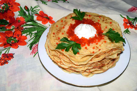 Appetizing pancakes with red caviar. Traditional cuisine.の写真素材
