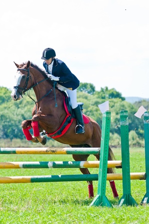 ARSENEV, RUSSIA - SEPTEMBER 03:  Unidentified rider in action rides horse show jumps at the Riding show のeditorial素材