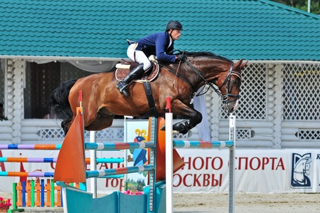MOSCOW, RUSSIA-JUNE 26: Rider Dyundikov Vitali(BLR) with a Anglo-trakehner horse Atlanta competes at the International event CSI4*RR/ Russian Championship Show Jumping on June 26, 2011 in Moscow, Russiaのeditorial素材