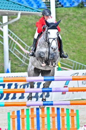 MOSCOW, RUSSIA - JUNE 26: Rider Simony Natalia(RUS) with a Holsten horse Solana13 competes at the International event CSI4*RR/ Russian Championship Show Jumping on June 26, 2011 in Moscow, Russiaのeditorial素材