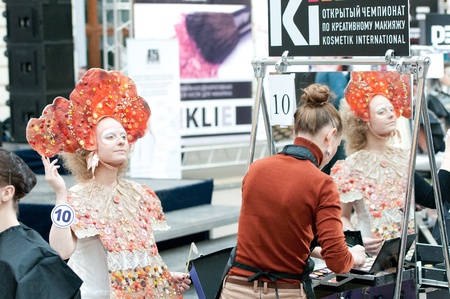 MOSCOW, RUSSIA-FEBRUARY 11  Stylist and model prepare on the IX Open Championship for creative makeup KOSMETIK international on February 11, 2012 in Moscow, Russia  Theme  Photoshoot  Face of future»のeditorial素材