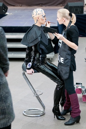 MOSCOW, RUSSIA-FEBRUARY 11  Stylist and model prepare on the IX Open Championship for creative makeup KOSMETIK international on February 11, 2012 in Moscow, Russia  Theme  Photoshoot  Face of future»のeditorial素材