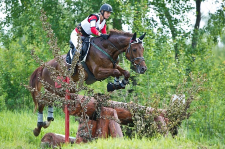 MOSCOW - JUNE 02  Unidentified rider on horse is overcomes the obstacle at the International Eventing Competition CCI3  2  1  Russian Cup Eventing June 02, 2012 in Moscow, Russiaの写真素材