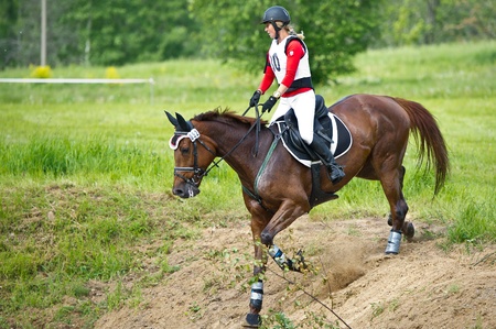 MOSCOW - JUNE 02  Unidentified rider on horse is overcomes the obstacle at the International Eventing Competition CCI3  2  1  Russian Cup Eventing June 02, 2012 in Moscow, Russiaの写真素材