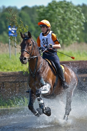 MOSCOW - JUNE 02  Unidentified rider on horse is overcomes the obstacle at the International Eventing Competition CCI3  2  1  Russian Cup Eventing June 02, 2012 in Moscow, Russiaの写真素材