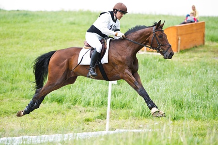 MOSCOW - JUNE 02  Unidentified rider on horse is overcomes the obstacle at the International Eventing Competition CCI3  2  1  Russian Cup Eventing June 02, 2012 in Moscow, Russiaの写真素材