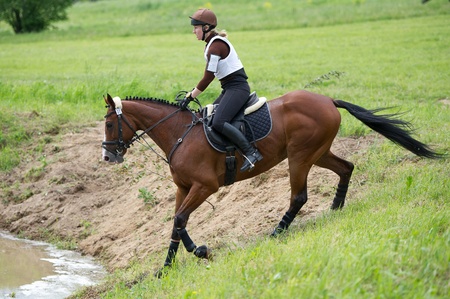 MOSCOW - JUNE 02  Unidentified rider on horse is overcomes the obstacle at the International Eventing Competition CCI3  2  1  Russian Cup Eventing June 02, 2012 in Moscow, Russiaの写真素材