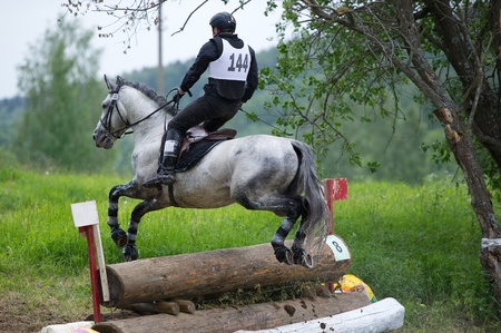 MOSCOW - JUNE 02  Unidentified rider on horse is overcomes the obstacle at the International Eventing Competition CCI3  2  1  Russian Cup Eventing June 02, 2012 in Moscow, Russiaの写真素材