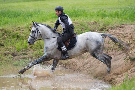 MOSCOW - JUNE 02  Unidentified rider on horse is overcomes the obstacle at the International Eventing Competition CCI3  2  1  Russian Cup Eventing June 02, 2012 in Moscow, Russiaの写真素材